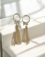 Golden Hoop Earrings With Bow Pendant - Image 2